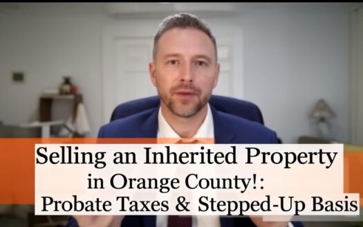 Real estate agent in blue suit with orange tie explaining inherited property sales in Orange County