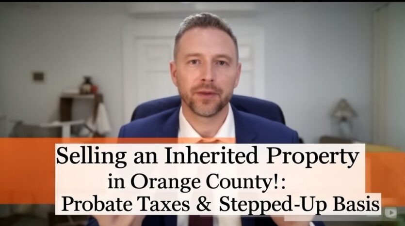 Real estate agent in blue suit with orange tie explaining inherited property sales in Orange County